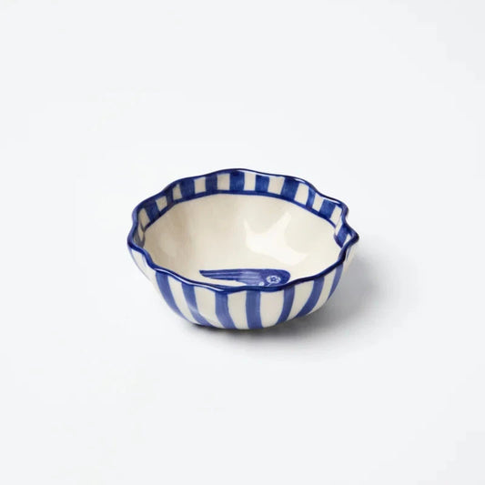 Small ceramic dish with blue and white striped pattern on a white background