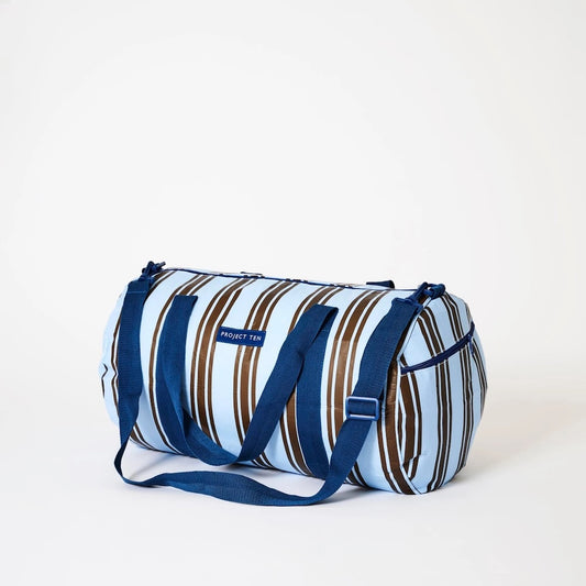 Side view of Striped duffel bag with blue straps on a white background