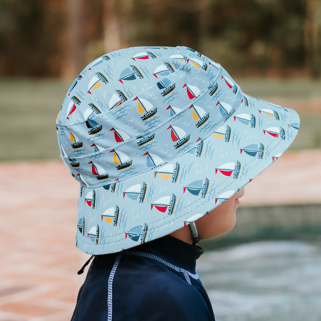 Side view of Bedhead Sails Swim Bucket Hat worn by a young model