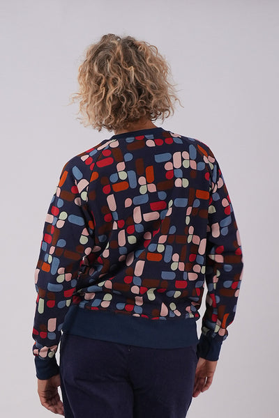 Back view of model wearing Essaye Abstract Sweater in Blue