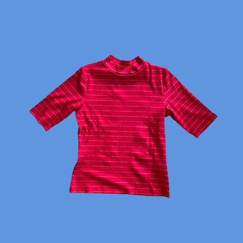 Frock Me Out Lurex Stripe Mock Neck Tee in Red. Fine gold threads are across the tee.