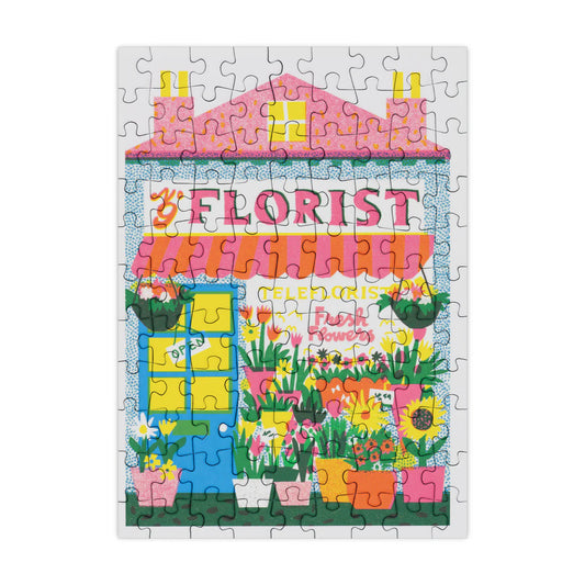 Completed mini puzzle of a florist shop with flowers and plants.
