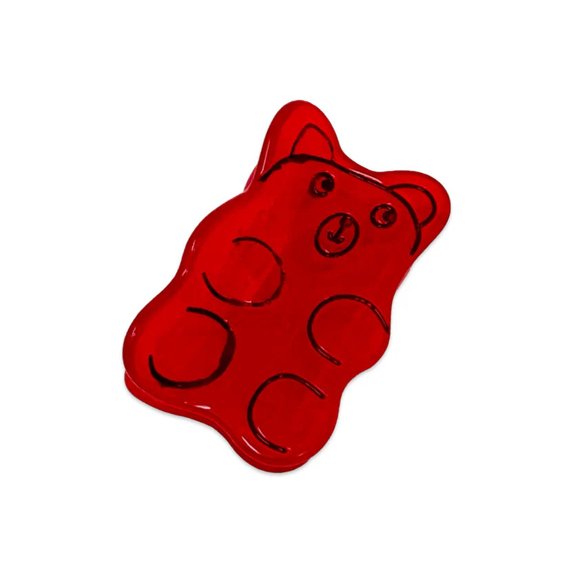 Red gummy bear hair clip with black outlines on a white background