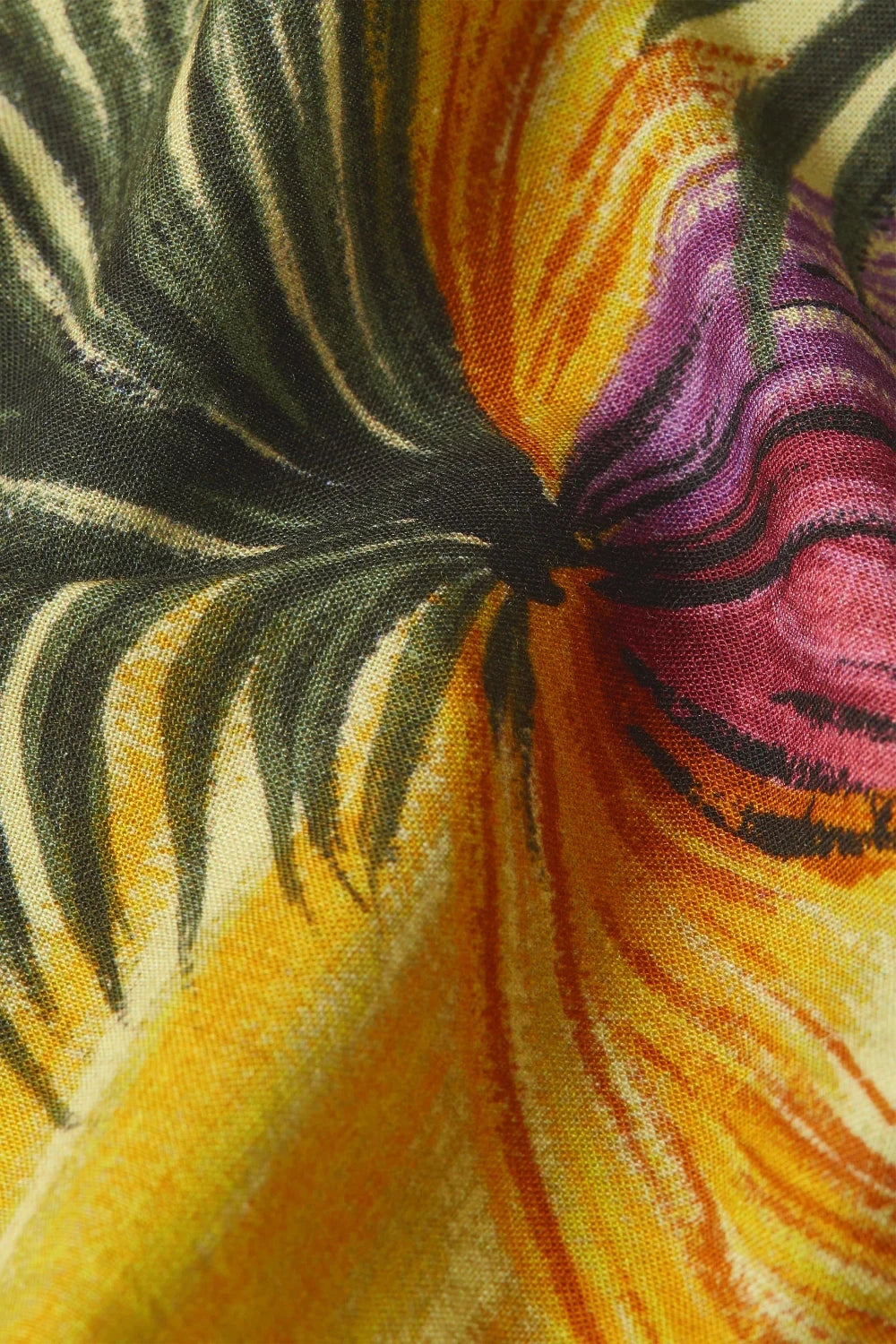 Close-up of colourful fabric with a vintage-inspired print