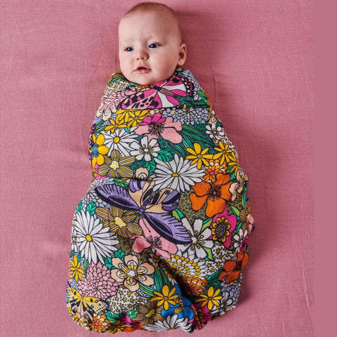 Kip & Co Bliss Floral Bamboo Baby Swaddle modelled by baby