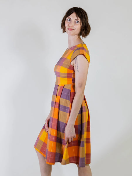 Side view of model wearing Mata Traders Devonshire Plaid Dress