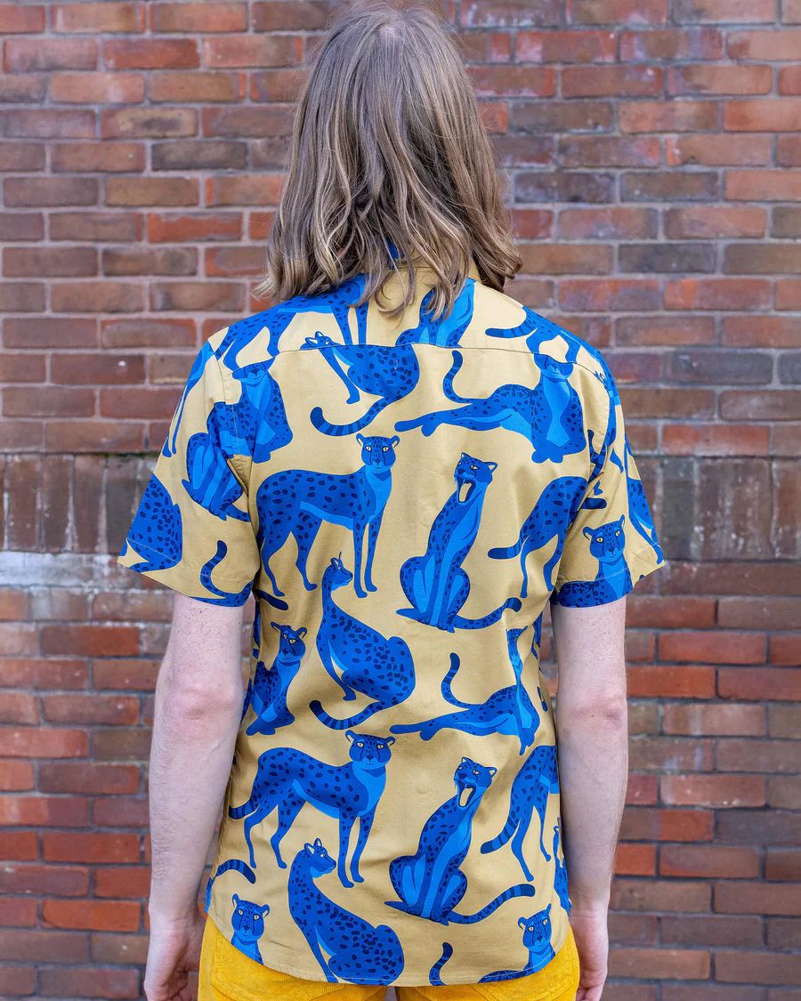 Back view of model wearing Run and Fly Leopard Shirt