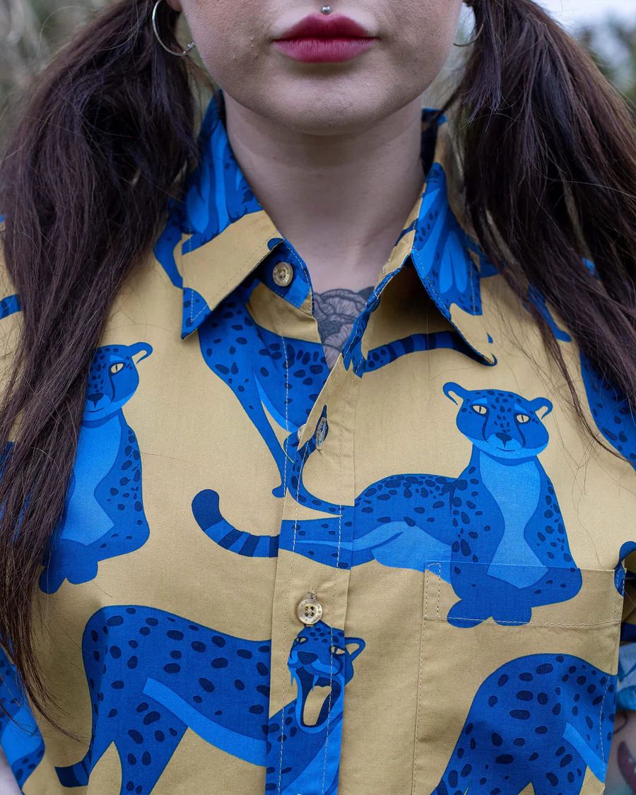 Close up of the collar and button details of the Run and Fly Leopard Shirt