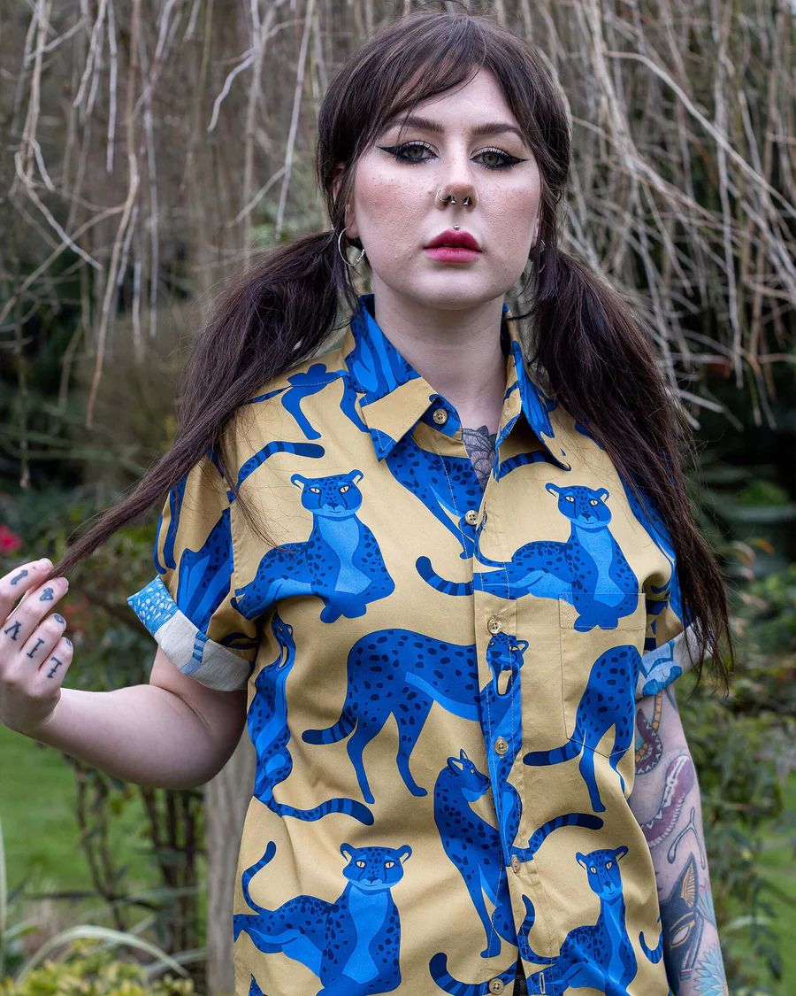 Model is wearing Run and Fly Leopard Shirt