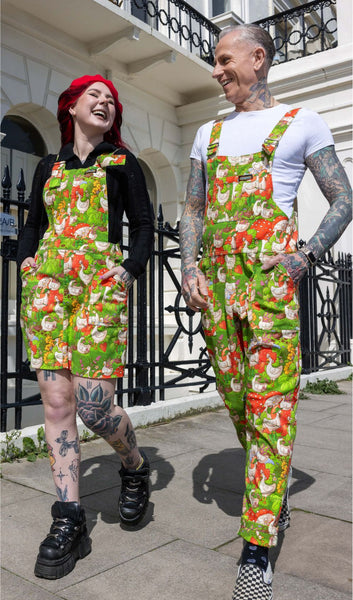 Run and Fly x The Mushroom Babes In The Geese Garden Stretch Twill Dungarees worn by model who is walking along a pavement with another model wearing Run and Fly x The Mushroom Babes In The Geese Garden Stretch Twill Pinafore.