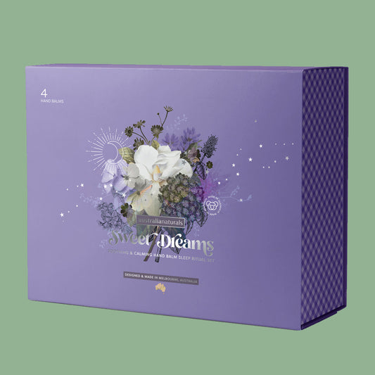 Purple packaging box with floral design and text on a white background