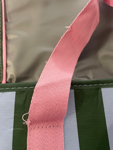 Close up of frayed strap on the Project Ten Green Blue Stripe Insulated Tote