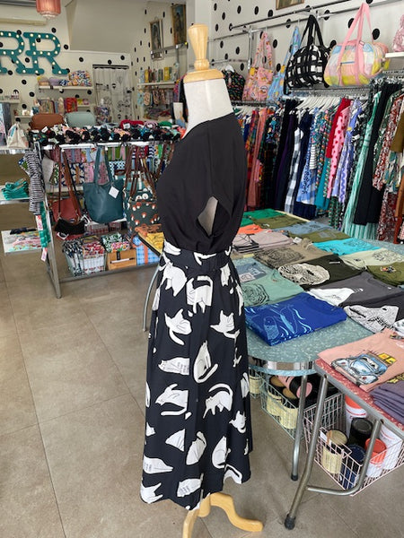 Side view of Mabel our Mannequin wearing Origami Doll Ashley Cat Skirt with a black top