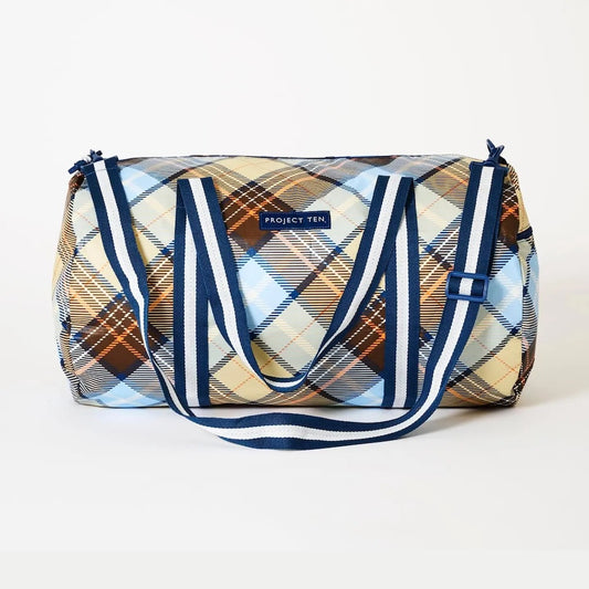 Plaid patterned bag with blue accents on a white background