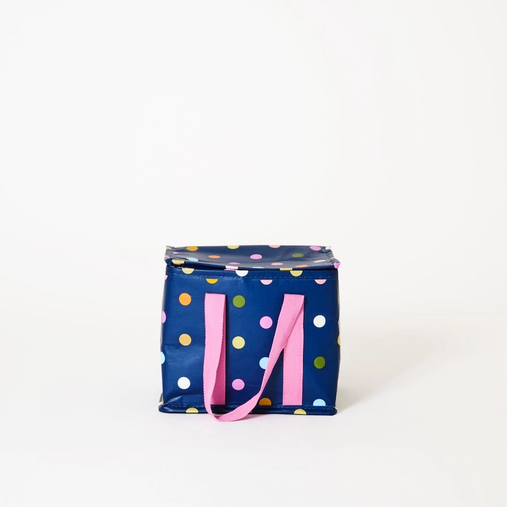 Polka dot bag with a pink handle on a white background