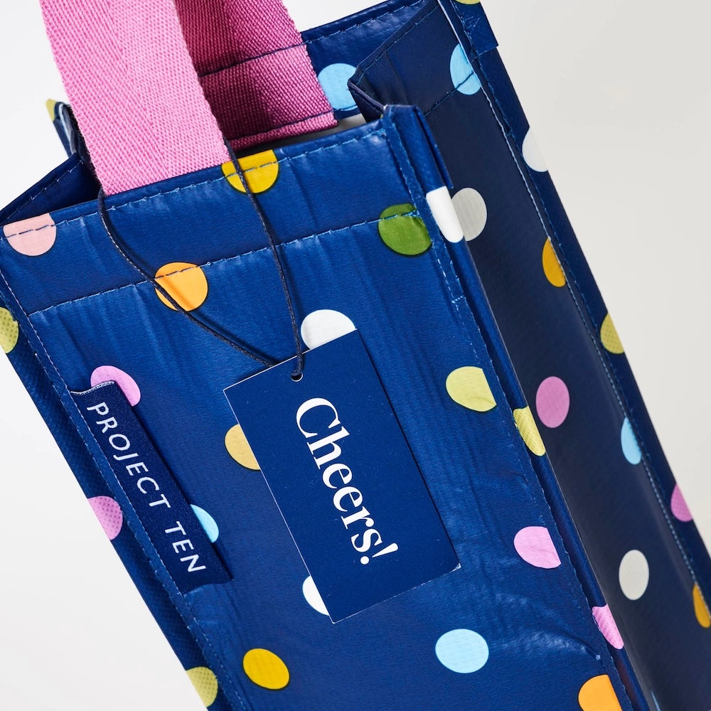 Blue bag with colorful polka dots and 'Cheers!' tag, featuring 'Project Ten' branding.