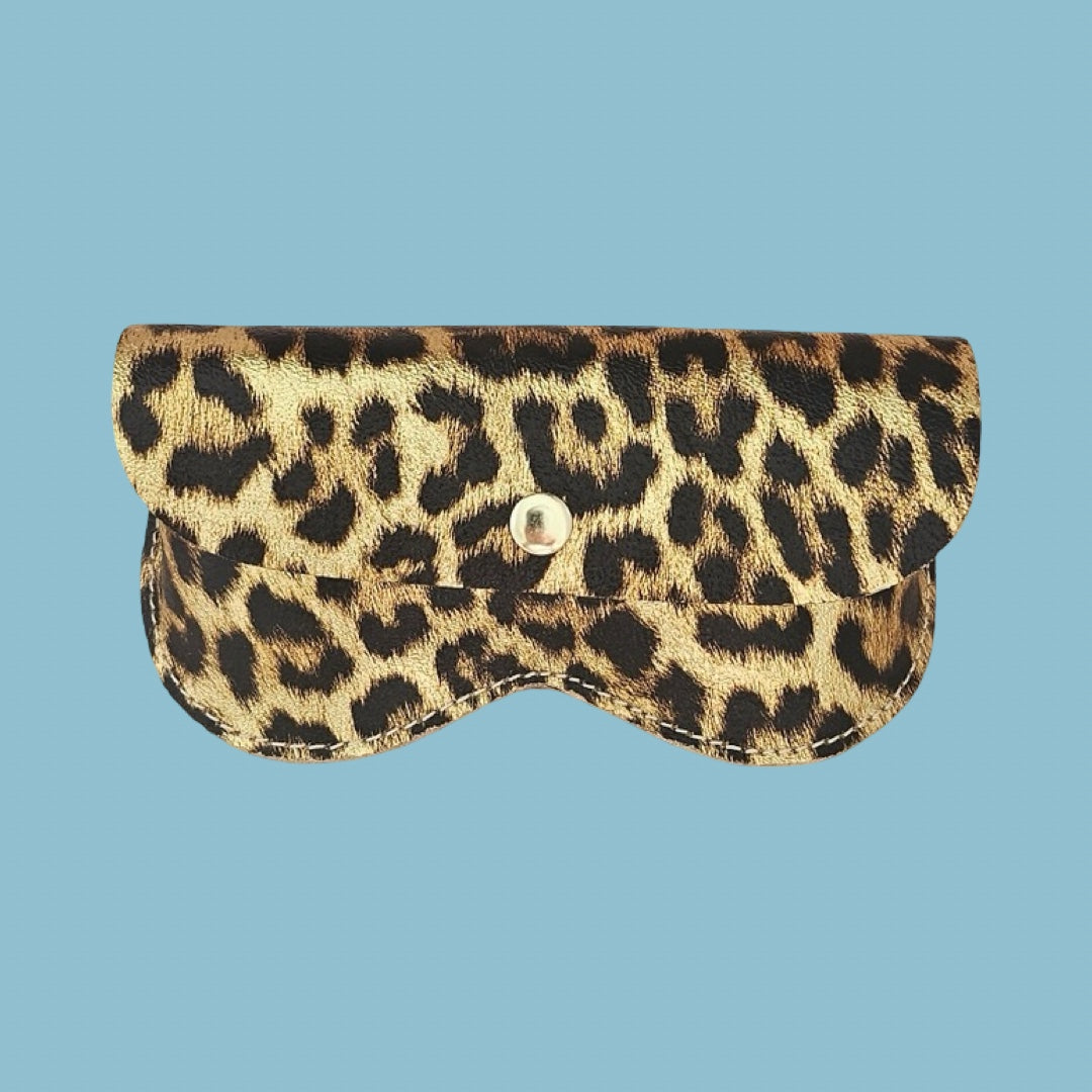 A leopard print glasses case with a flap closure and a silver snap button, shown against a solid light blue background.