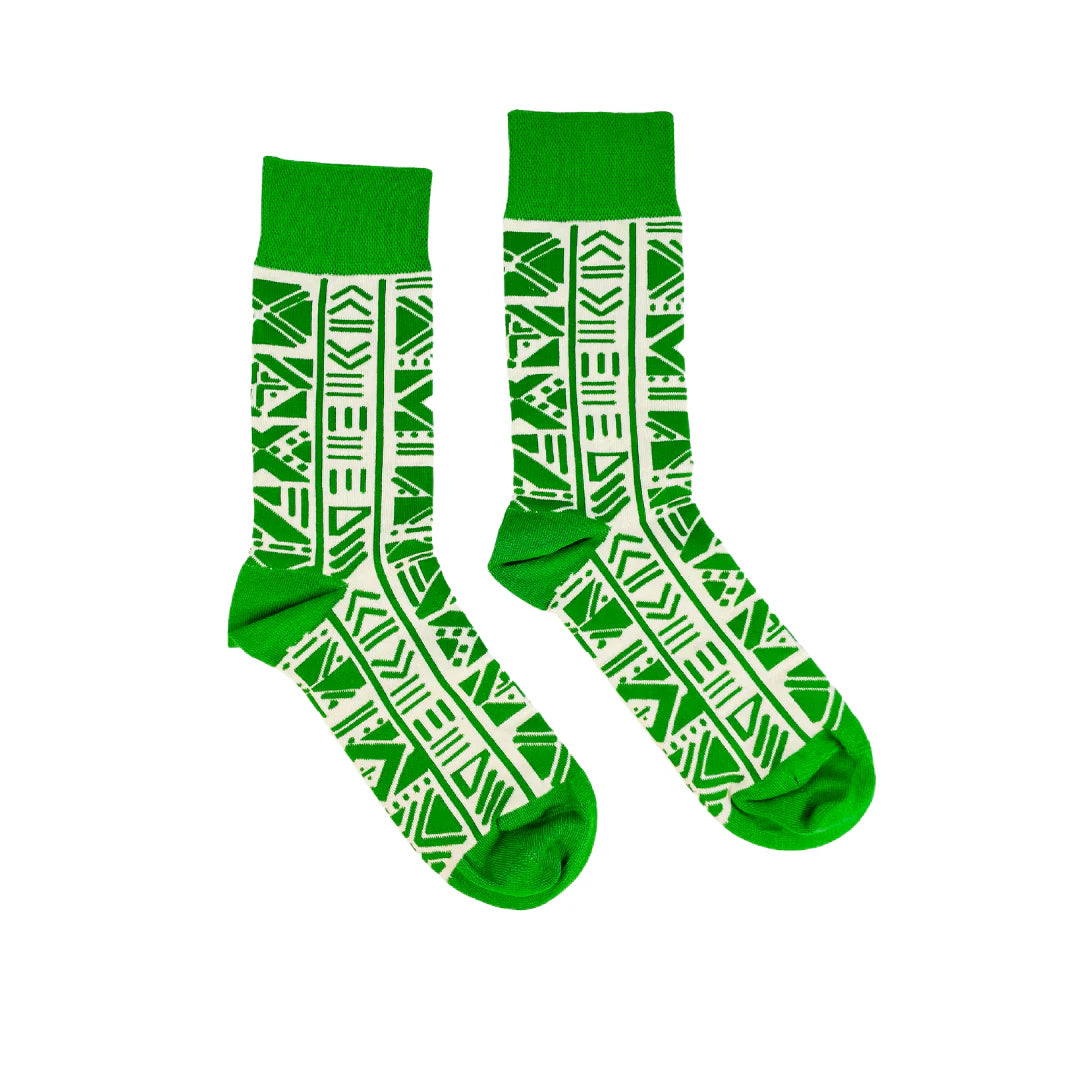 Green socks with white pattern on a white background