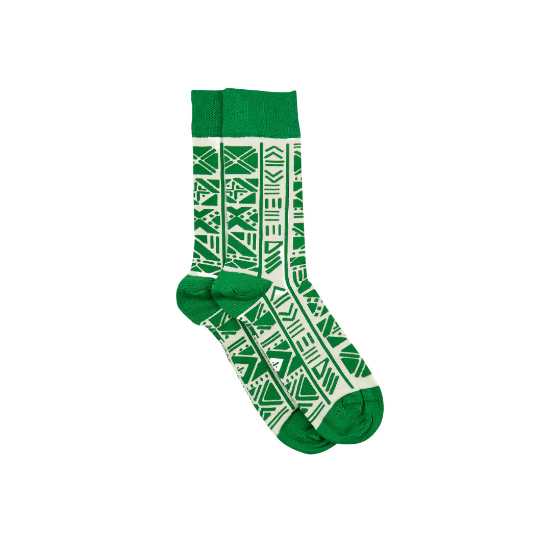 Green and white patterned socks on a white background