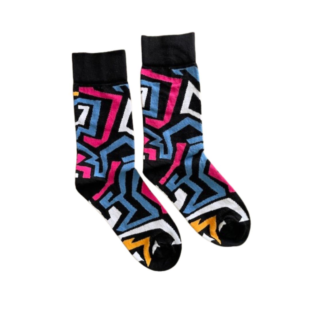 Colorful geometric-patterned socks on a white background