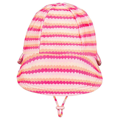 A pink and peach striped sun hat with a scalloped pattern, featuring a chin strap, shown against a plain white background.