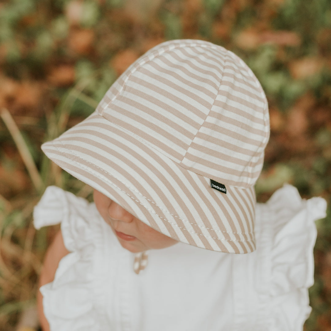 Side view of Bedhead Natural Stripe Bucket Hat for 1-2 years worn by a young model