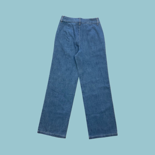 Frock Me Out denim jeans in a vintage blue wash on a pale blue background