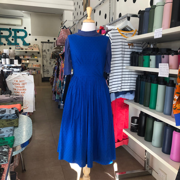 Frock Me Out Lurex Stripe Mock Neck Tee in Blue featuring on Mabel the Mannequin with blue dress over the tee.