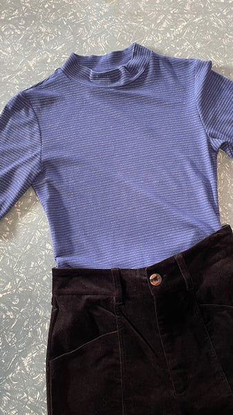 Frock Me Out Lurex Stripe Mock Neck Tee in Blue paired with a pair of black velvet pants