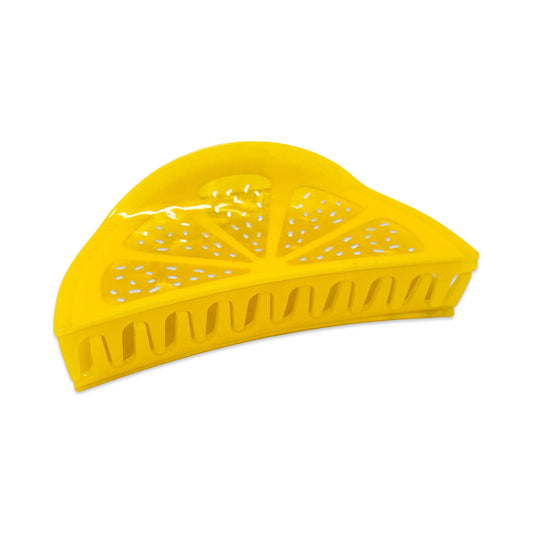 Yellow cellulose acetate hair claw shaped like a lemon on a white background