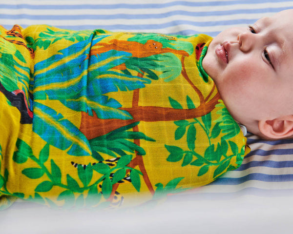 Kip & Co Jungle Boogie Bamboo Baby Swaddle modelled by baby