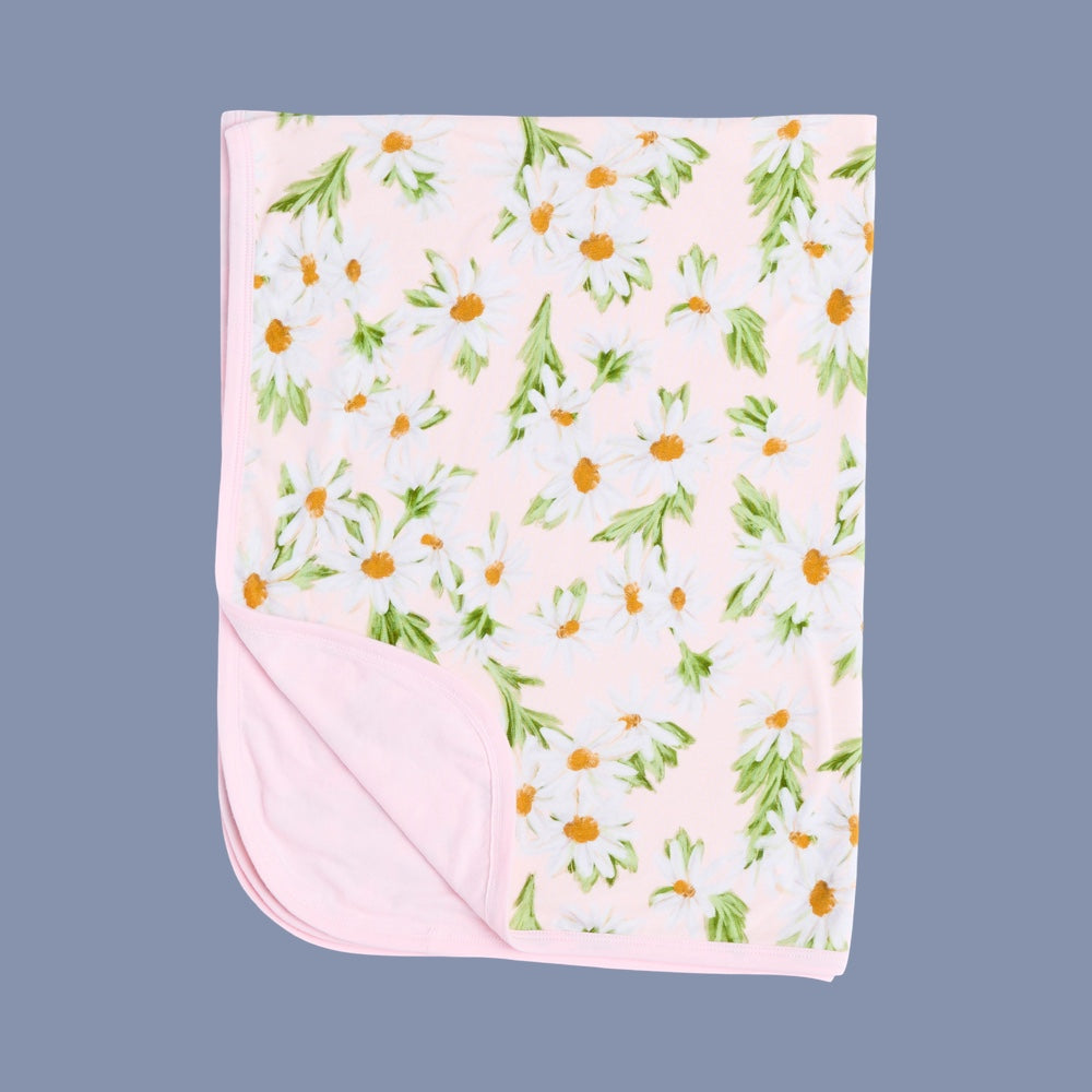 Floral patterned blanket on a solid background