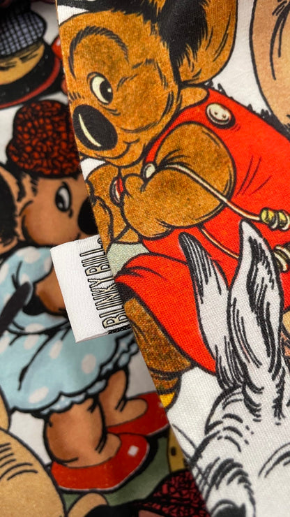 A close-up of Blinky Bill fabric featuring a vintage cartoon print and white fabric tag reading 'Blinky Bill'.