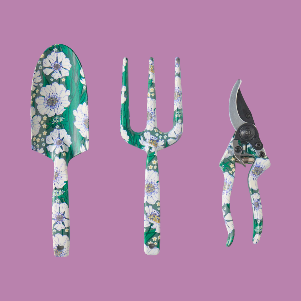 The 3 hand tools - spade, fork and secateur covered with the tumbling flower pattern.