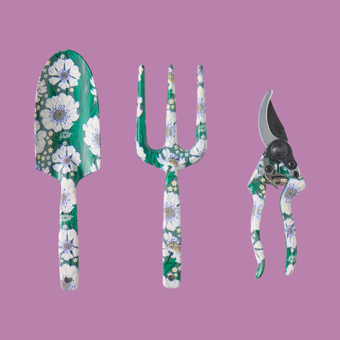 The 3 hand tools - spade, fork and secateur covered with the tumbling flower pattern.