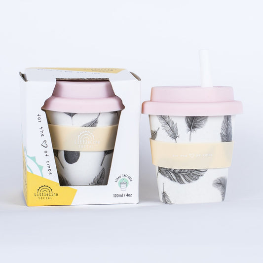 Reusable baby cino cup from Little Cino Social with pink lid and feather design packaging on a white background