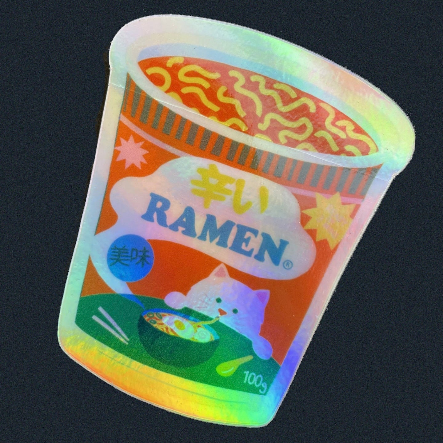 Holographic sticker by Naomi Wilkinson of ramen cup with a cat on a dark background