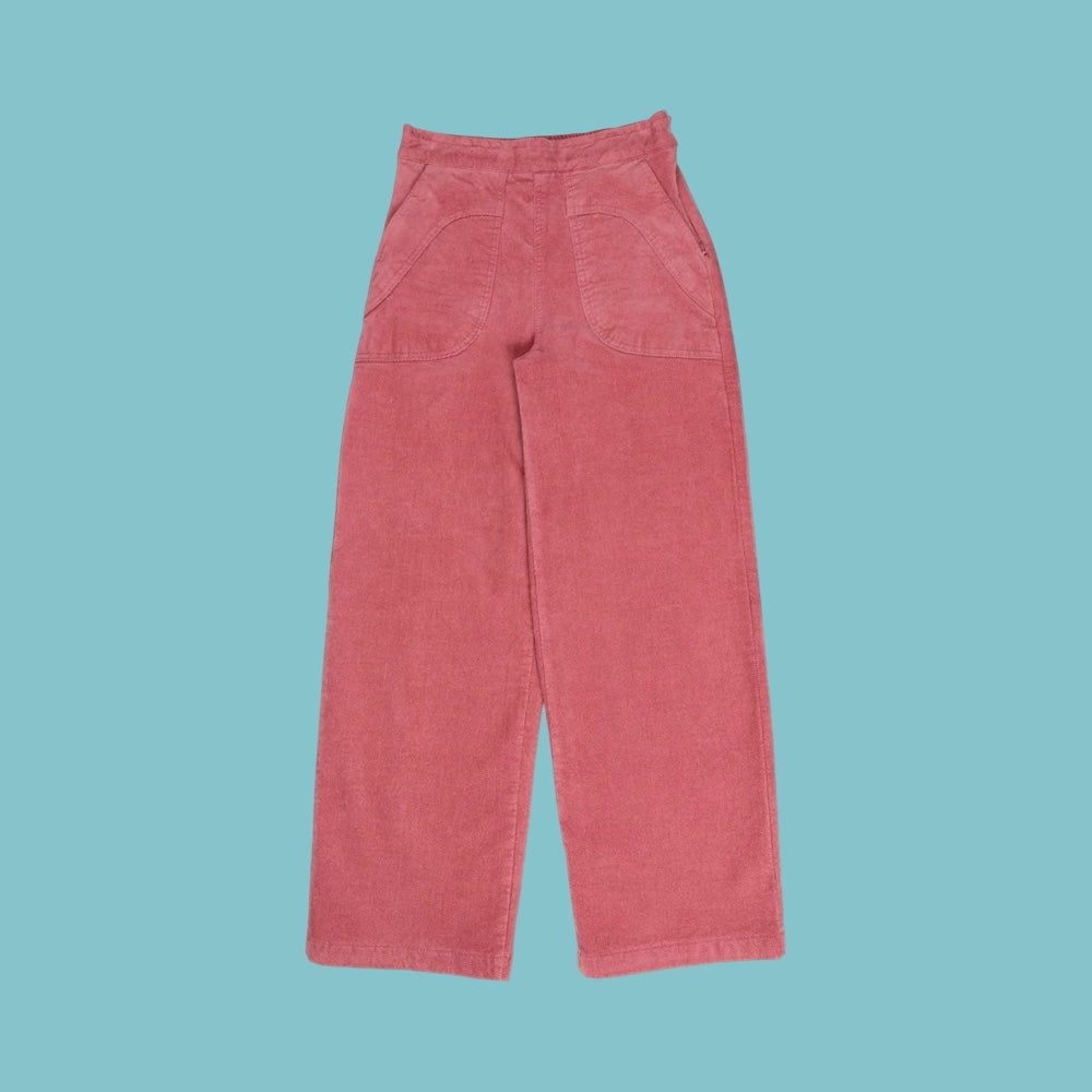Muted lolly pink corduroy pants on a light blue background