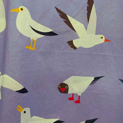 Close up of the top featuring seagulls in various postures.