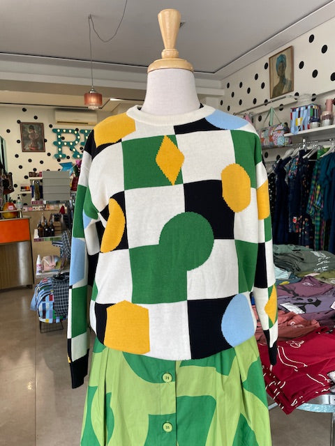 Closer view of a colourful geometric pattern jumper on Mabel our shop mannequin