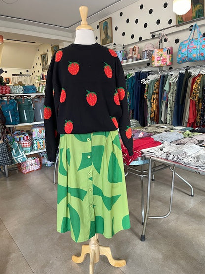 Black dress with red strawberries on Mabel our shop mannequin