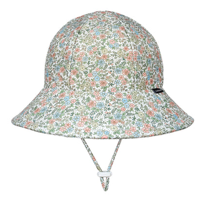A bucket-style sun hat with a dense multicolor floral print on a white background, featuring a chin strap with a white plastic toggle, shown against a plain white background.
