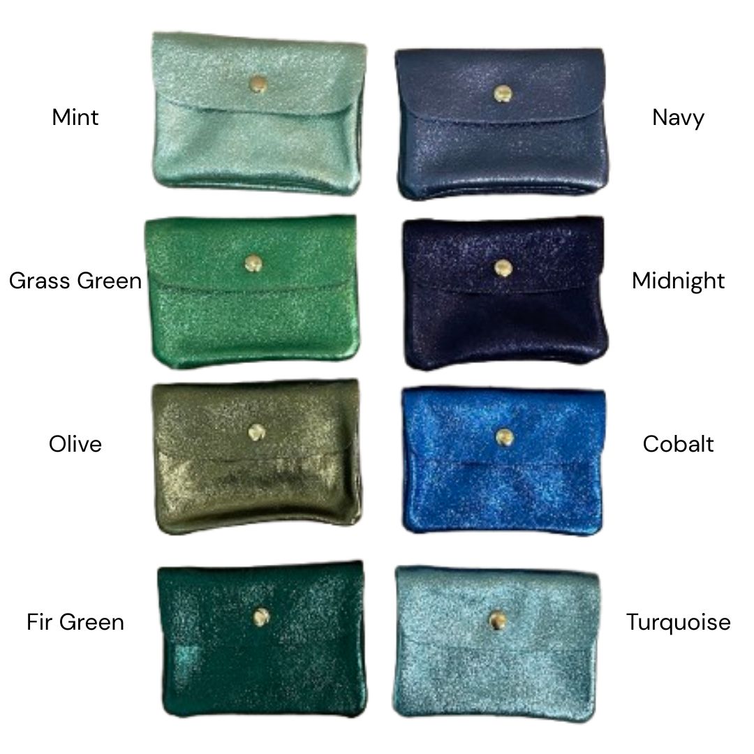Eight small metallic wallets shown in two columns on a white background, labeled with color names: Mint, Navy, Grass Green, Midnight, Olive, Cobalt, Fir Green, and Turquoise. Each pouch has a flap closure and a small round metallic button.