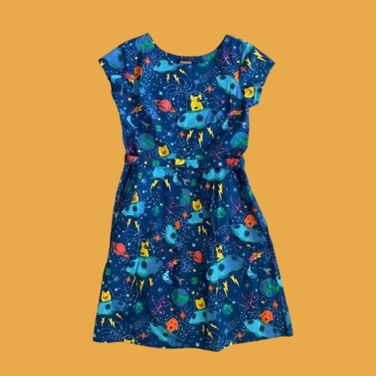 A dress with cartoon dogs in spaceships pattern
