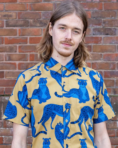 Model is wearing Run and Fly Leopard Shirt.