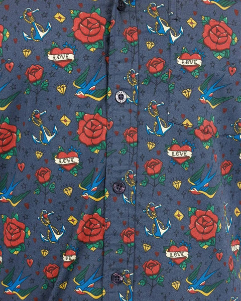 Close up of the button details on Run and Fly Retro Tattoo Print Shirt.