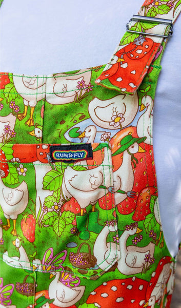 Close up for the front panel of Run and Fly x The Mushroom Babes In The Geese Garden Stretch Twill Dungarees worn by model.