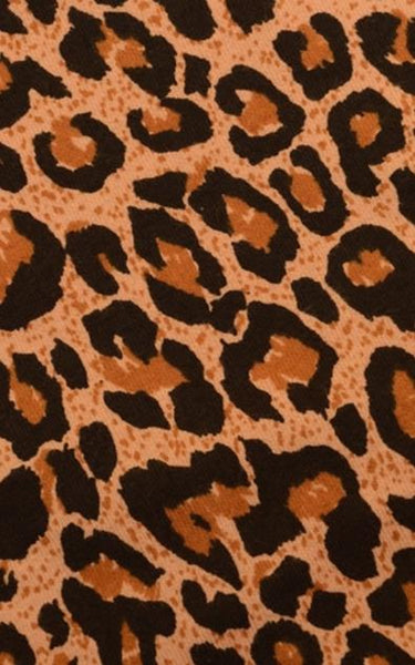 Image is a close up swatch of leopard print fabric